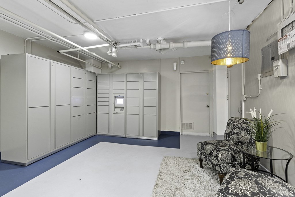 Cozy seating area in laundry room complete with package receiving lockers at Stockbridge Apartment Homes, Seattle, Washington 98101