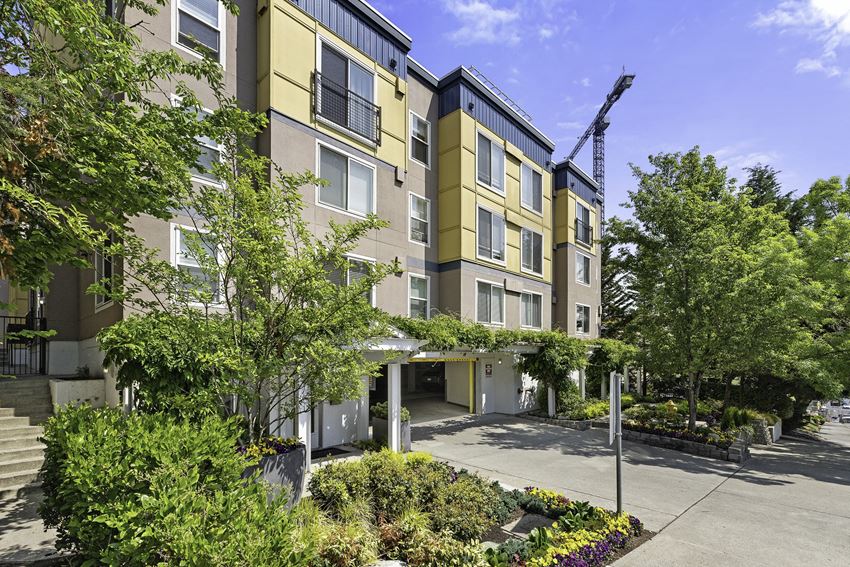a large apartment building with a crane in the background at Sir Gallahad Apartment Homes, Bellevue, Washington 98004 - Photo Gallery 1