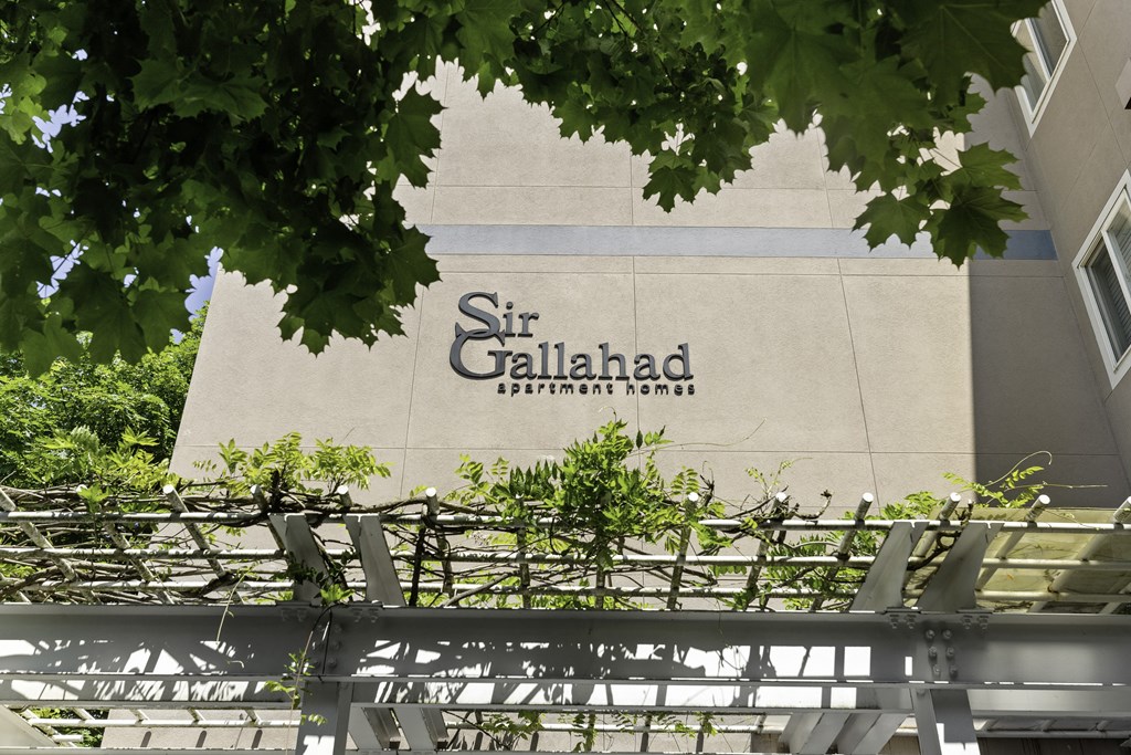 a sign on the side of a building at Sir Gallahad Apartment Homes, WA 98004