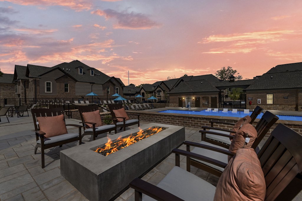 a backyard patio with a fire pit and lounge chairs  at Griffin Weston, North Carolina, 27513