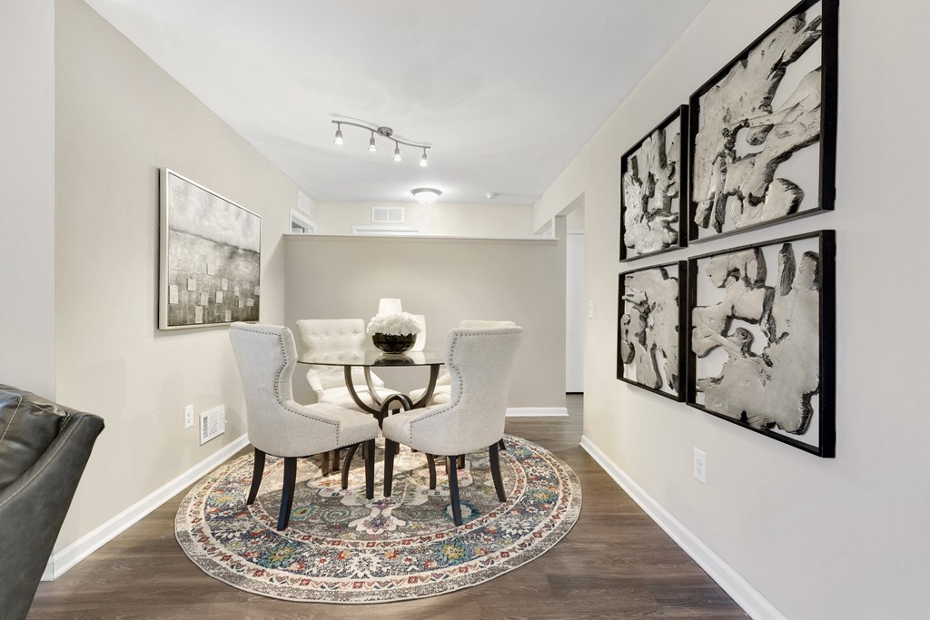 a dining room with a table and chairs  at Northridge, Rochester Hills, MI