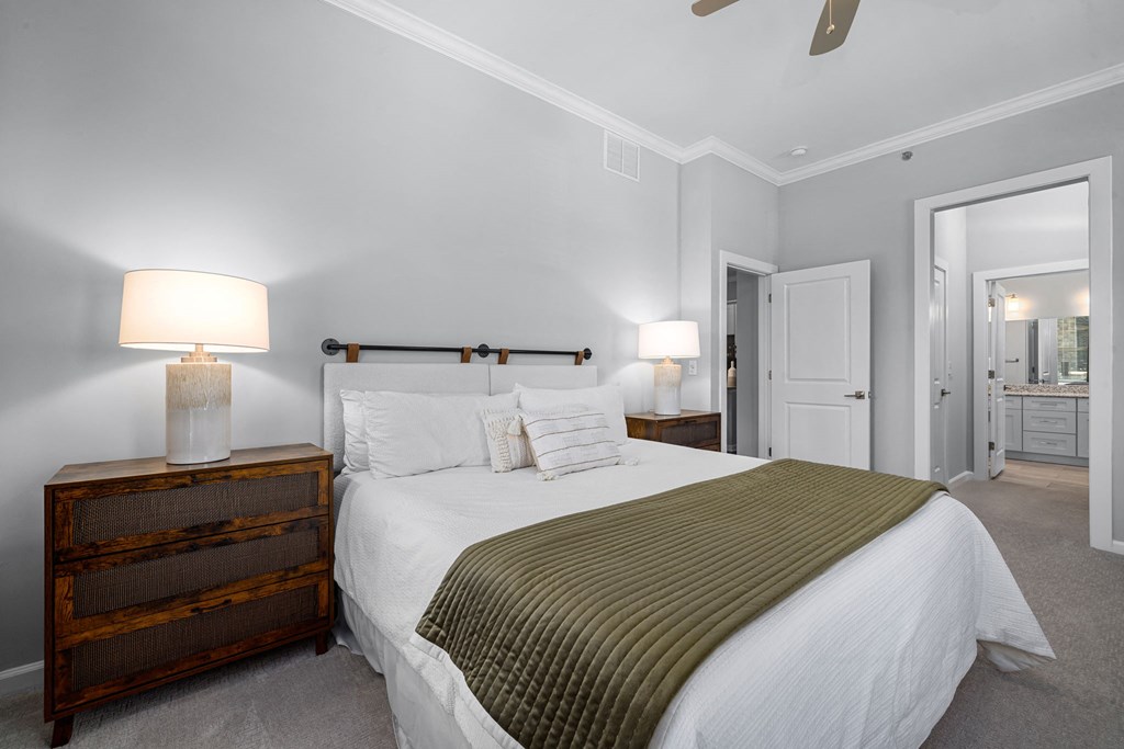 a bedroom with a bed and a dresser  at Griffin Weston, North Carolina, 27513