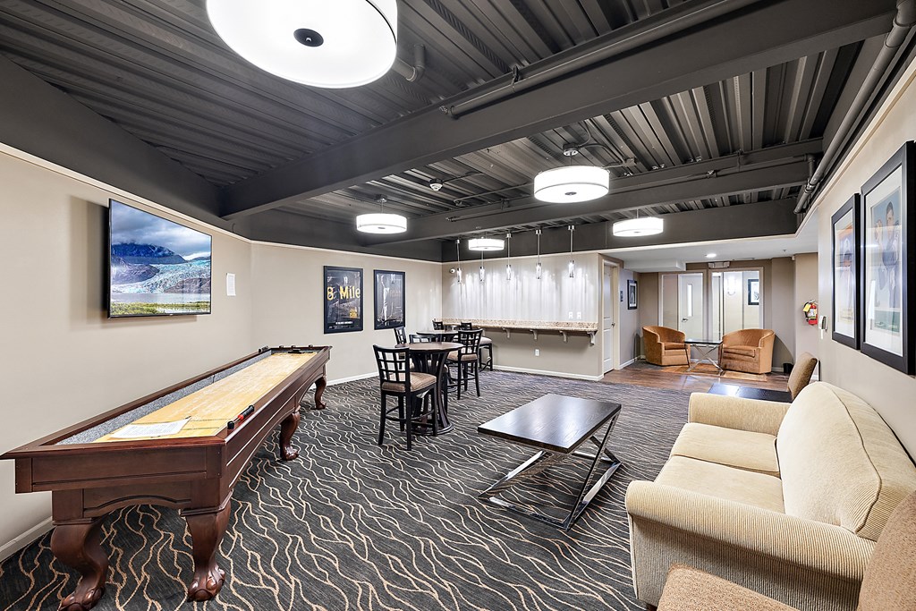 A room with a pool table and a couch at MainCentre, Northville