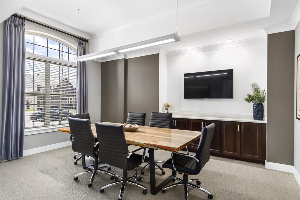A conference room with a long table and chairs at Park West, Canton, 48187