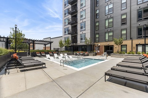 Outdoor pool with lounge chairs
