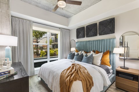 Spacious bedroom with ceiling fan