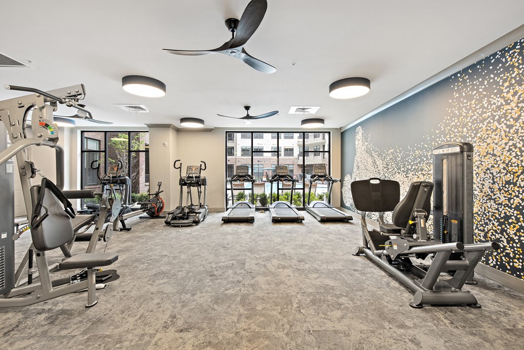 a fitness center with treadmills and other exercise equipment  at The Griffin Royal Oak, Michigan, 48067