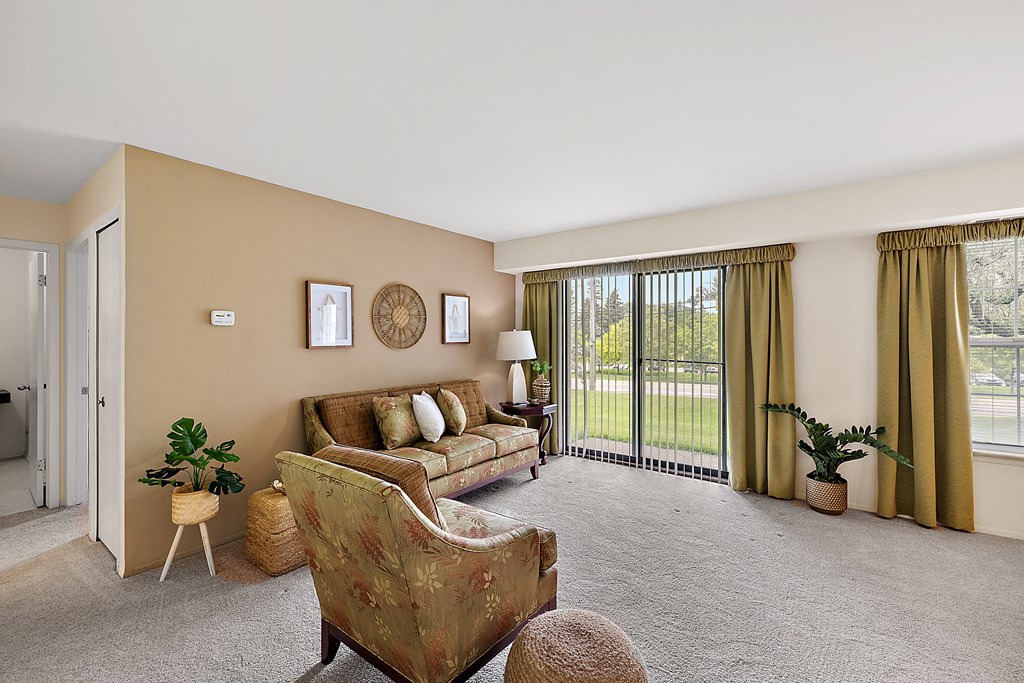 a living room with a couch and chair  at Northridge, Rochester Hills, MI, 48307