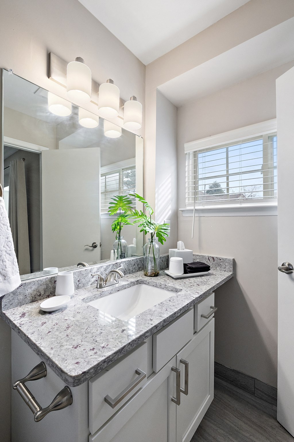 a bathroom with a sink and mirror  at Northridge, Rochester Hills, MI, 48307
