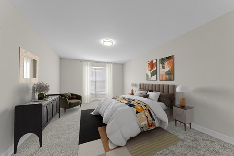 A bedroom with a large bed and a dresser at Amberly Apartments, West Bloomfield, 48322