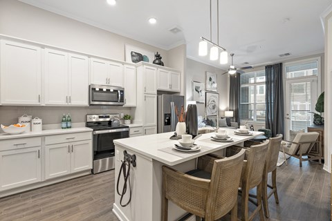 an open kitchen and dining area with a table and chairs