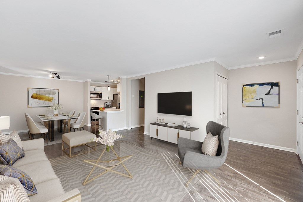 a living room with a couch and a chair at Cidermill Village, Michigan