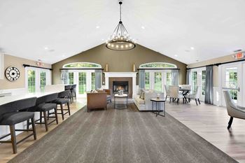 A living room with a fireplace and a chandelier.