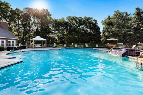A large swimming pool with a gazebo in the background at Briarcliff Village, Michigan, 48390