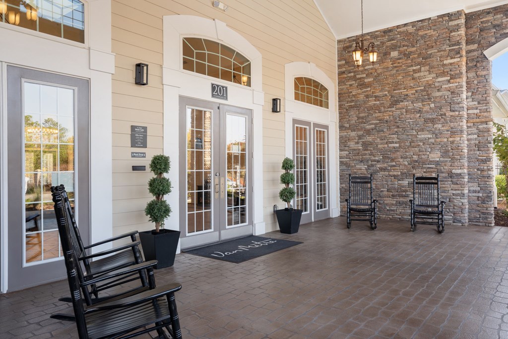 A building with a stone wall and a glass door.