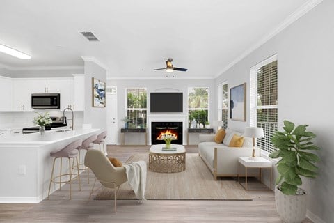 a living room with white walls and a white couch with a coffee table in front of it at Northlake Park, Orlando, FL, 32827