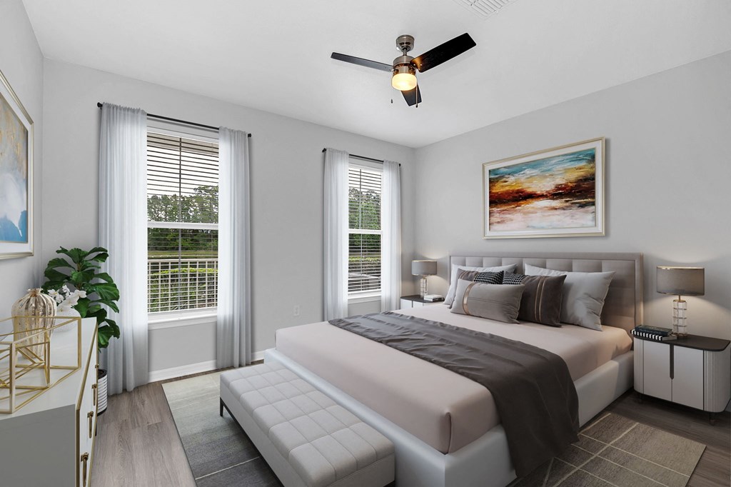a bedroom with a large bed and two windows at Northlake Park, Orlando, FL