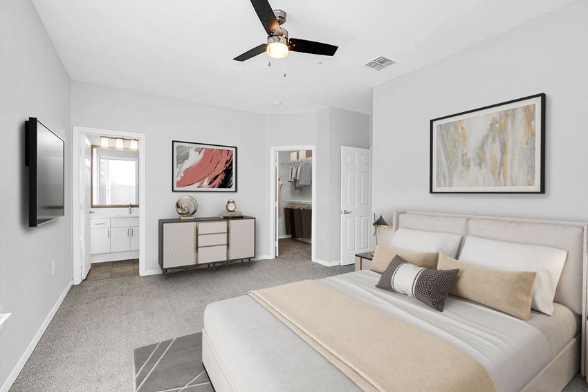 a bedroom with a large bed and a ceiling fan - Photo Gallery