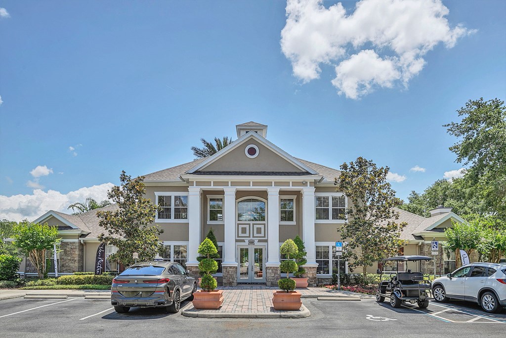 a large building with cars parked in front of it at Northlake Park, Orlando