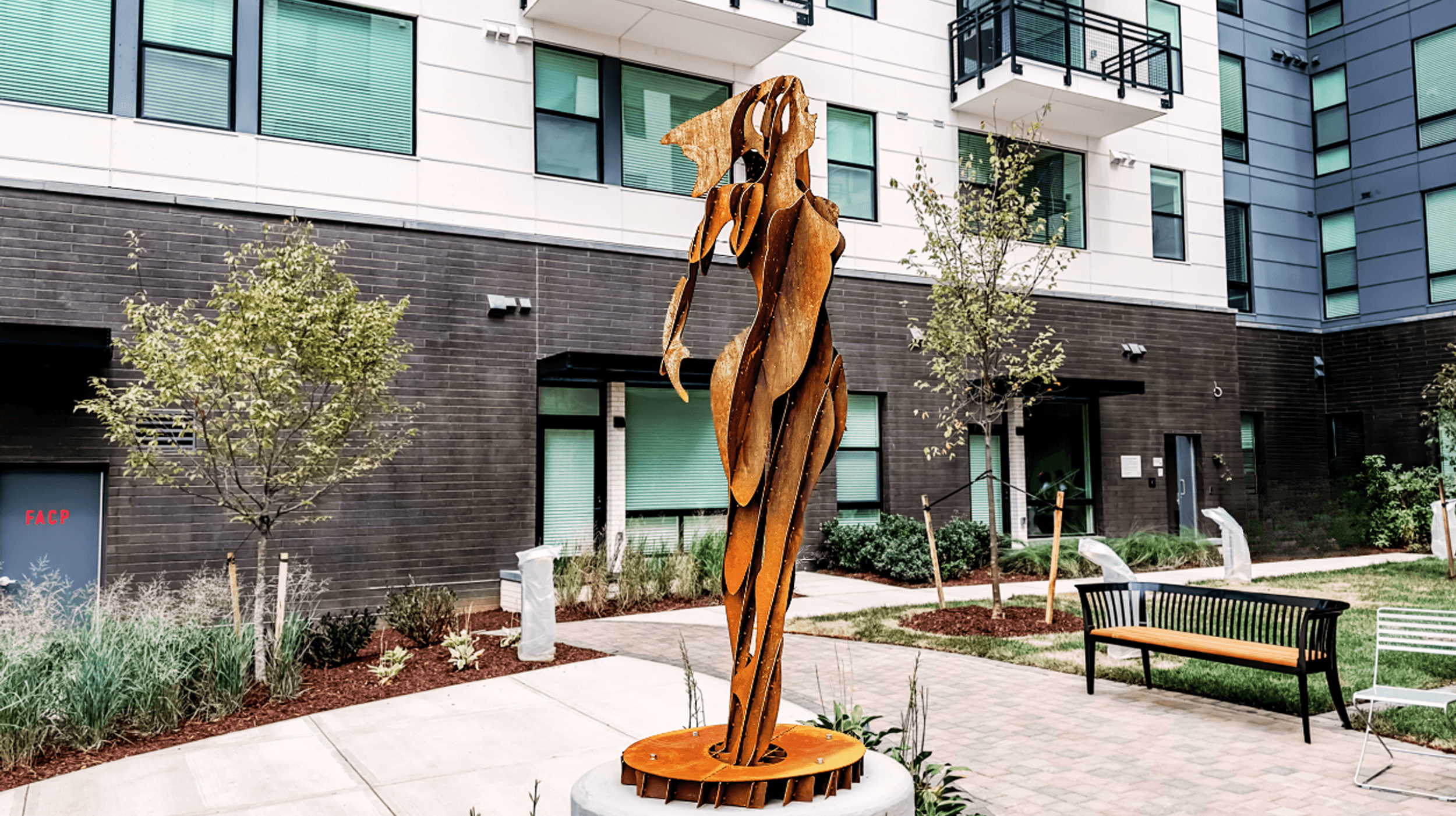 a statue of a woman in the courtyard of a building