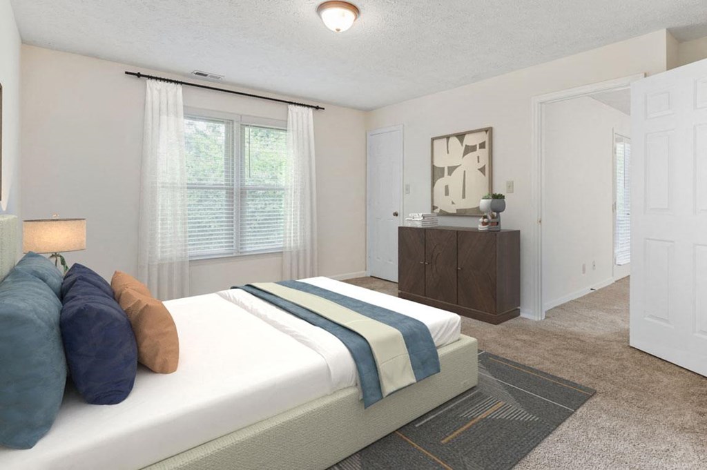 a bedroom with a bed and a dresser at Hunter's  Ridge Apartments, Fayetteville, North Carolina