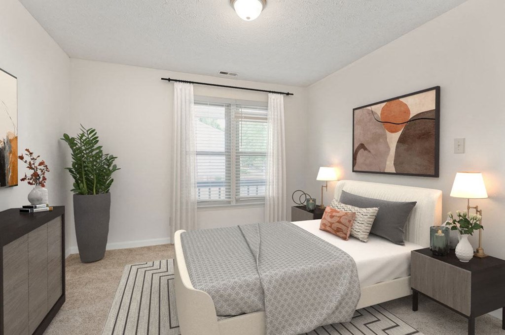 a bedroom with a bed and a window at Hunter's  Ridge Apartments, Fayetteville, North Carolina