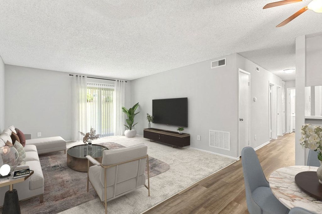 Living Room with a Couch and a TV at Lakes Edge Apartments, Greensboro, North Carolina