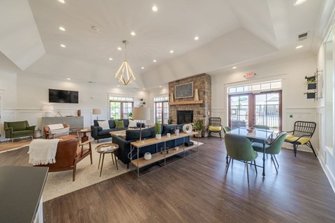 A spacious living room with a fireplace and a dining area.