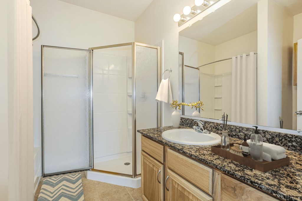 a bathroom with a sink and a shower at Stone Gate Apartments in NC