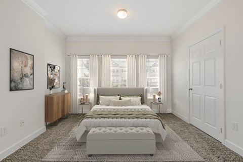 a bedroom with a bed and a large window at Stone Gate Apartments in NC at Stone Gate Apartments, Spring Lake, NC