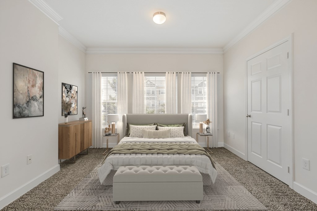 a bedroom with a bed and a large window at Stone Gate Apartments in NC at Stone Gate Apartments, Spring Lake, NC