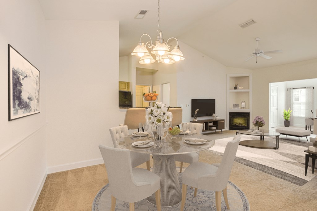 a dining room with a table and chairs and a living room at Stone Gate Apartments, Spring Lake, NC