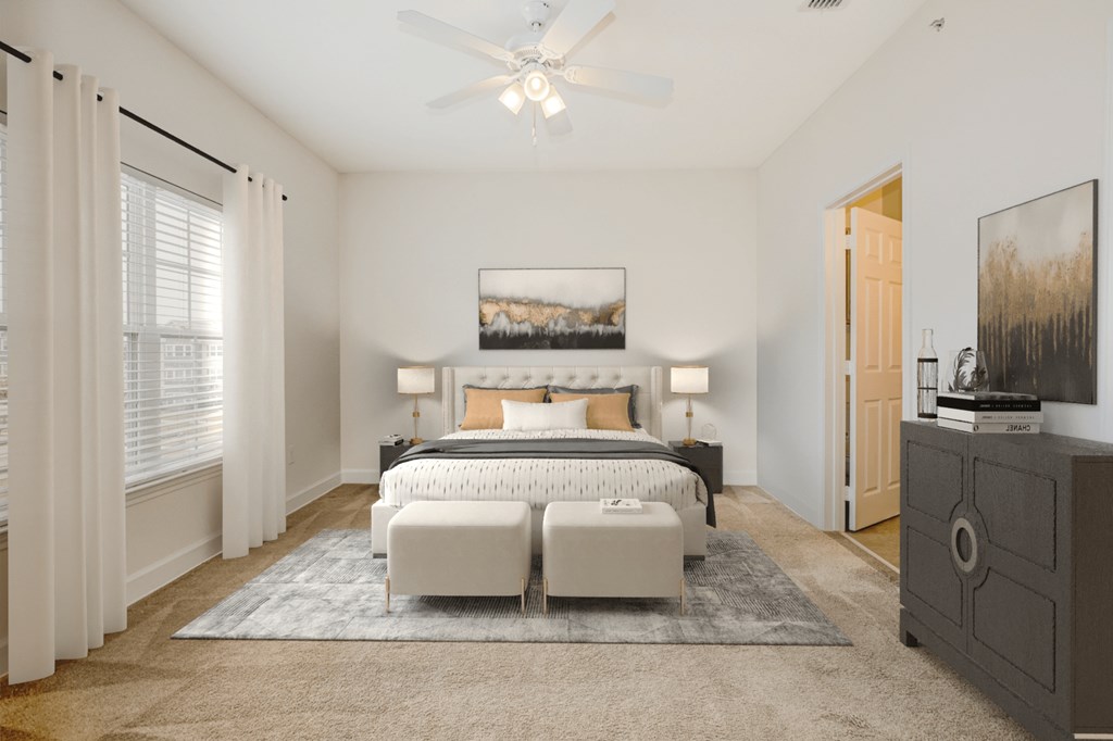 a bedroom with a bed and a ceiling fan at Stone Gate Apartments in NC