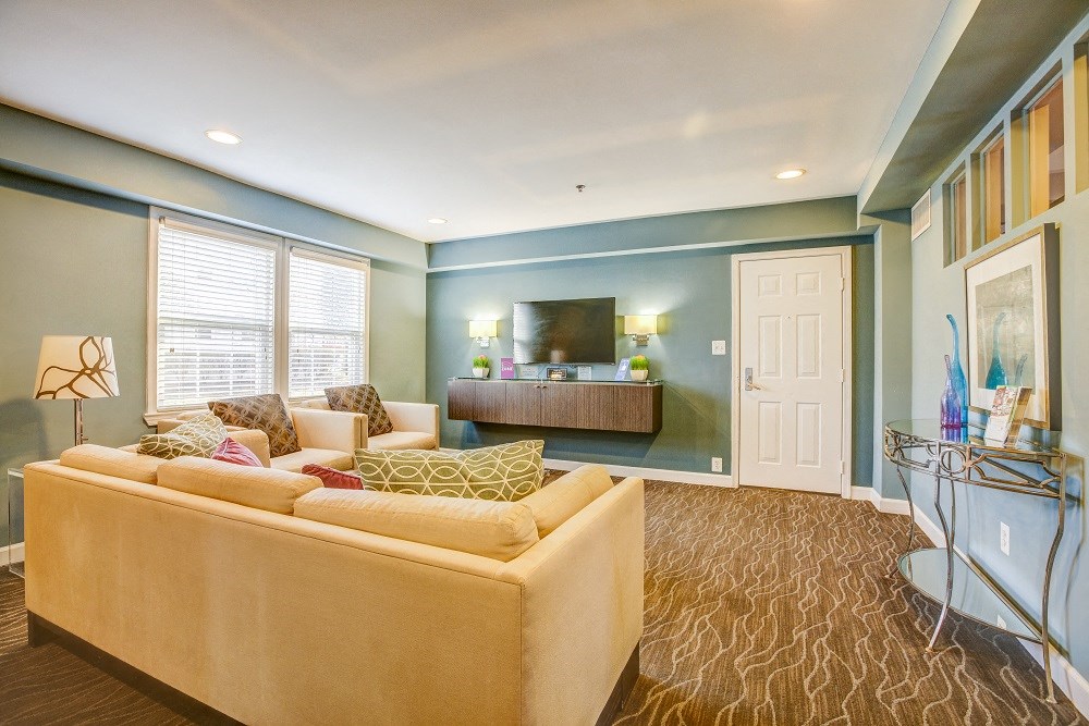 a living room with a couch and a tv