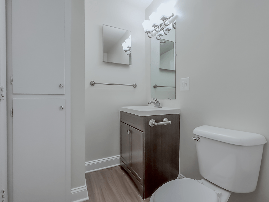 a bathroom with a toilet and a sink and a mirror at Middletown Valley, Maryland