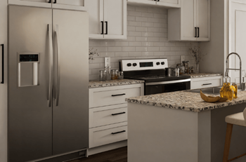 A modern kitchen with a refrigerator, stove, and countertop.at The Landings at Hard Scrabble, Columbia South Carolina