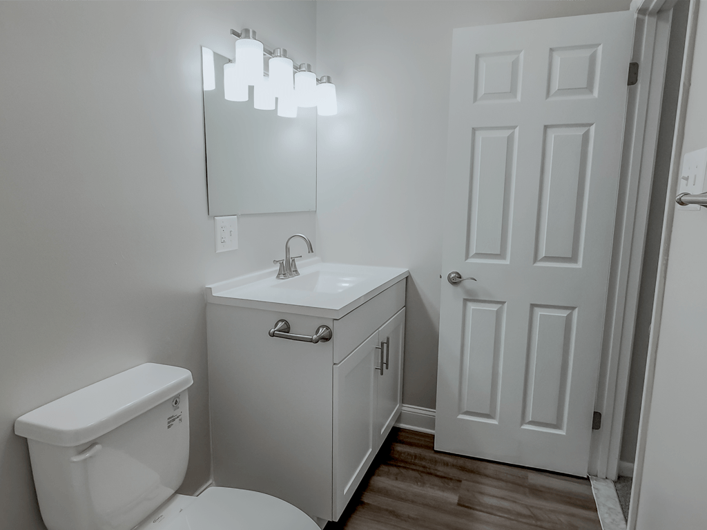 an empty bathroom with a toilet sink and mirror at Middletown Valley, MD