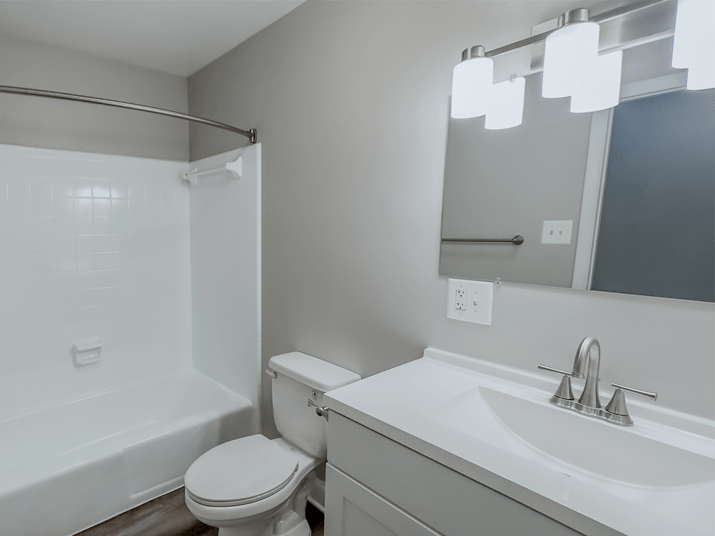 an empty bathroom with a sink toilet and shower at Middletown Valley, 21769