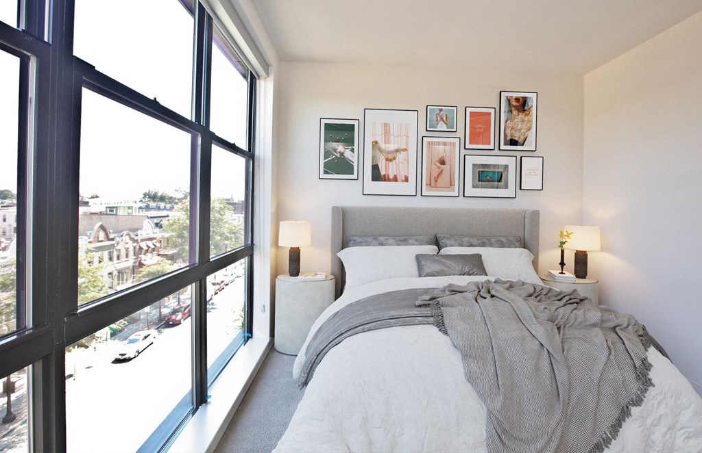 Comfortable Bedroom With Large Window at Fahrenheit Apartments, Washington, DC