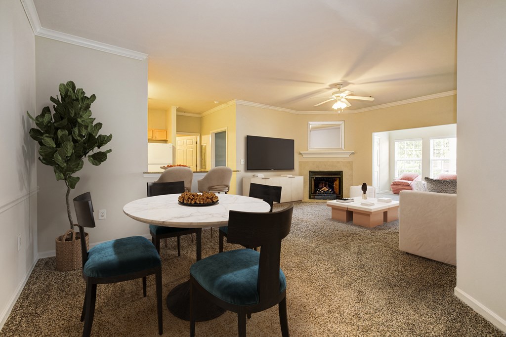 Living Room with a round table at Village on the Lake Apartments, Spring Lake, North Carolina