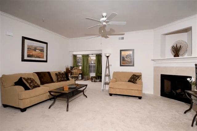 Living Room and Sunroom at Village on the Lake Apartments, North Carolina