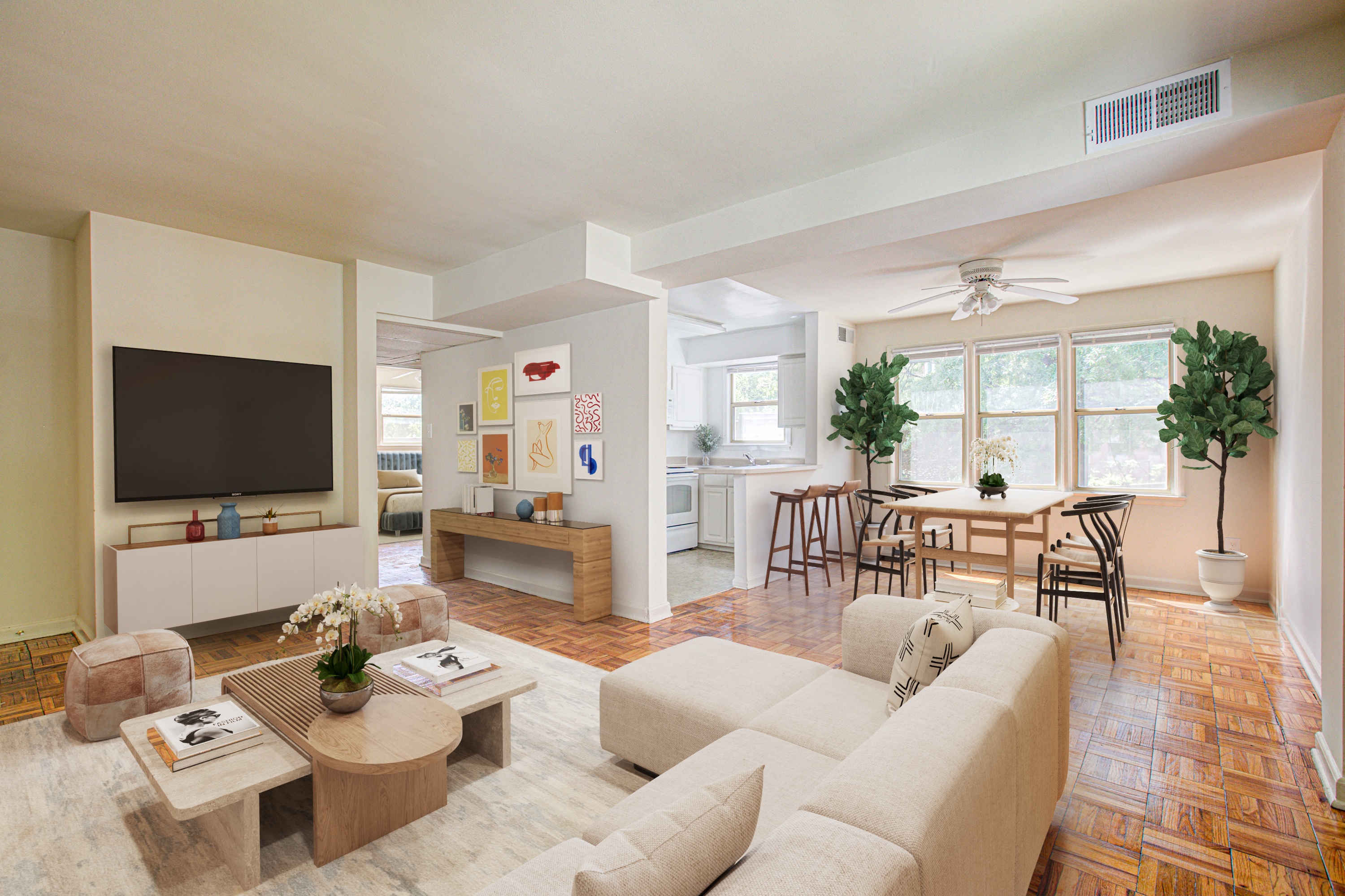 A living room with a white couch and a wooden coffee table.