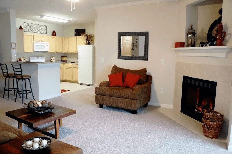 Living Room and Kitchen with bar stools at Village on the Lake Apartments, North Carolina