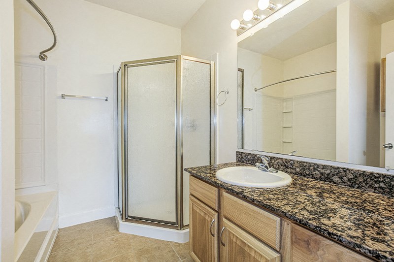 Bathroom with marble tiles at Stone Gate Apartments, Spring Lake, North Carolina