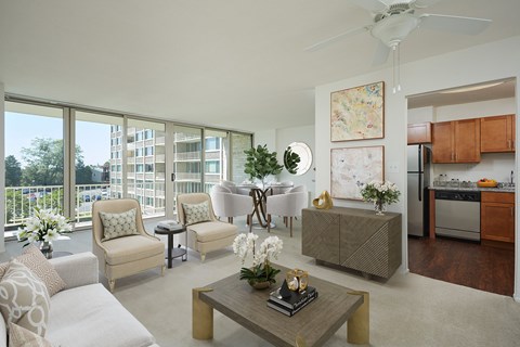 A living room with a couch, chairs, and a coffee table.