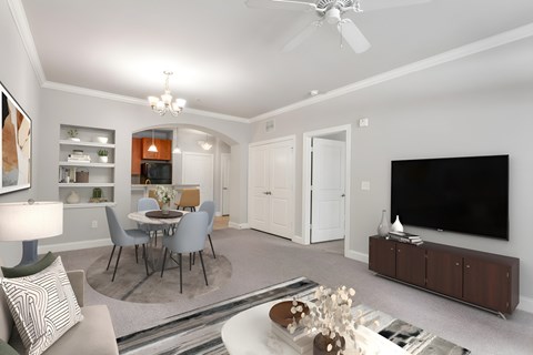 A modern living room with a dining table and chairs.