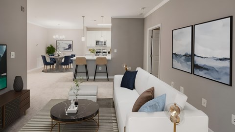 A modern living room with a white sofa and a coffee table.