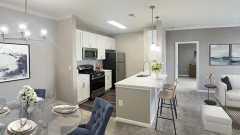 A modern kitchen with a dining table set for two.