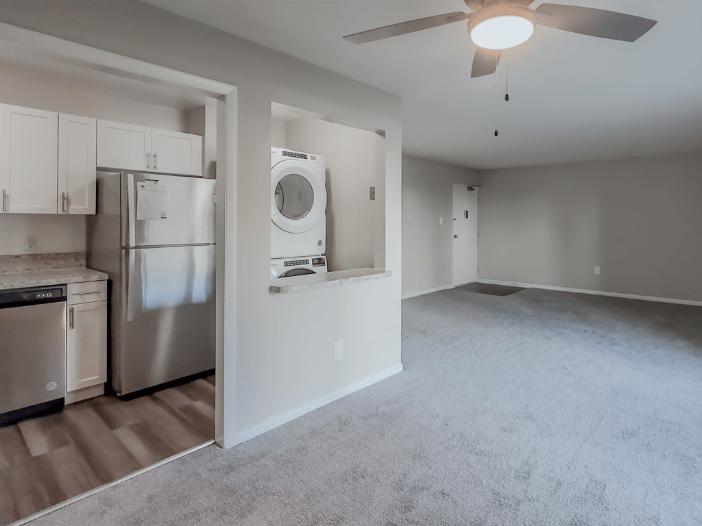 an empty living room and kitchen with a washer and dryer in it at Middletown Valley, MD