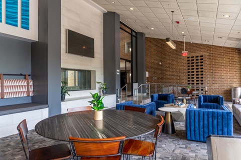 A modern dining area with a round table and chairs.